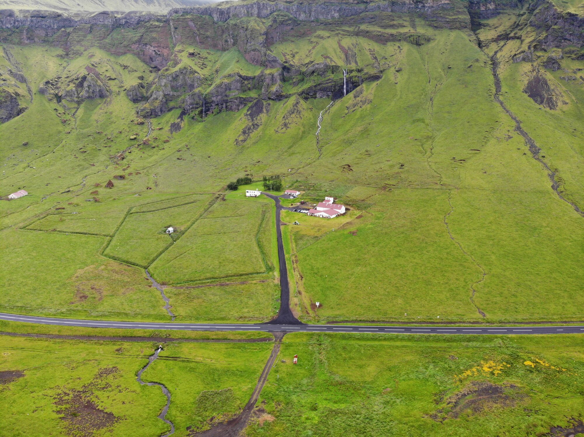 The farm buildings at Varmahlíð under the cliffs of Eyjafjöll